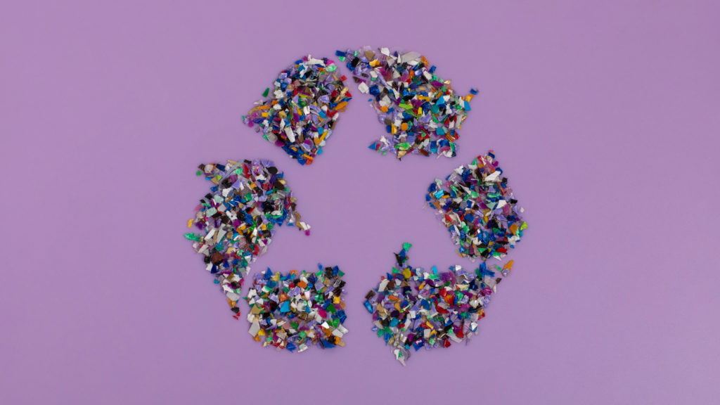 Recycle,Symbol,Consisting,Of,Small,Plastic,Pellets,Collected