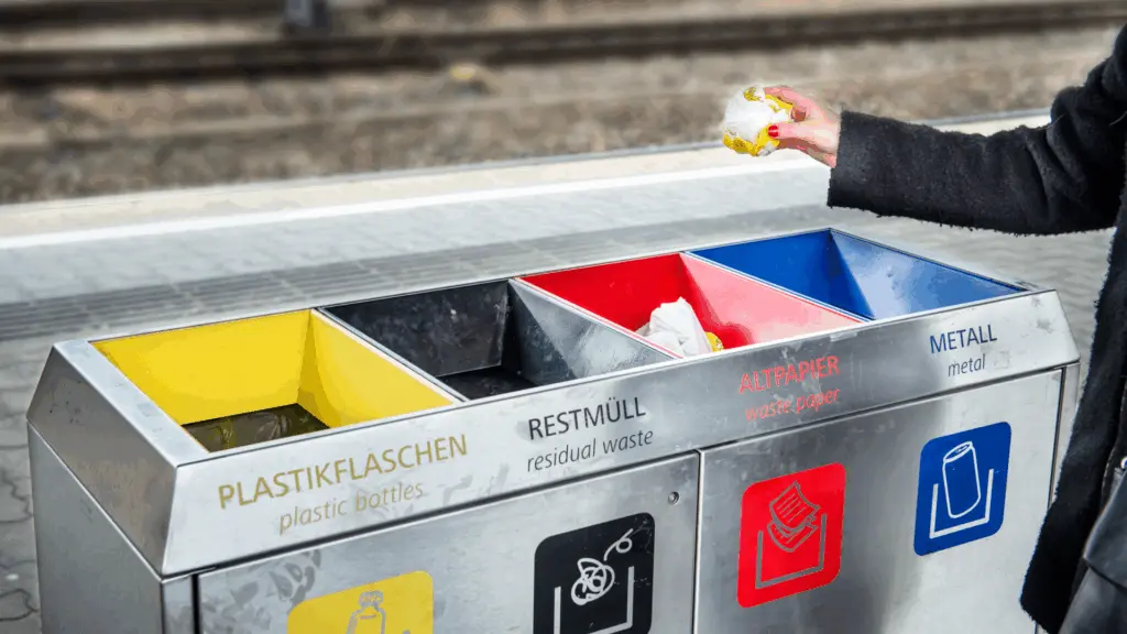 On image: A modern recycling container featuring multiple sorting lockers for easy separation of waste.