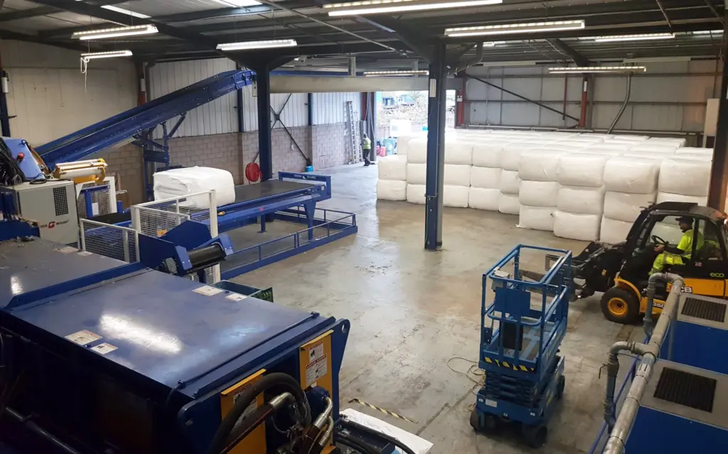 Fortress Recycling facility with Cross Wrap Direct Wrapper and wrapped bales waiting for the next stage.