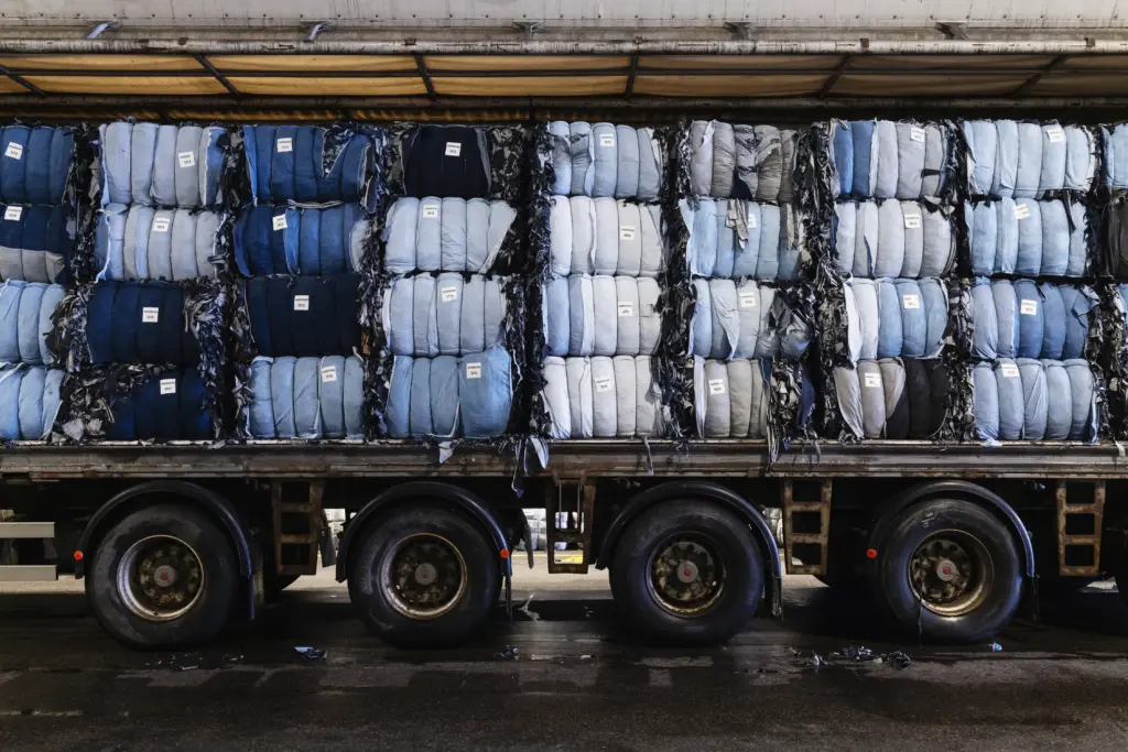 Textile bales on a truck waiting for the recycling processing